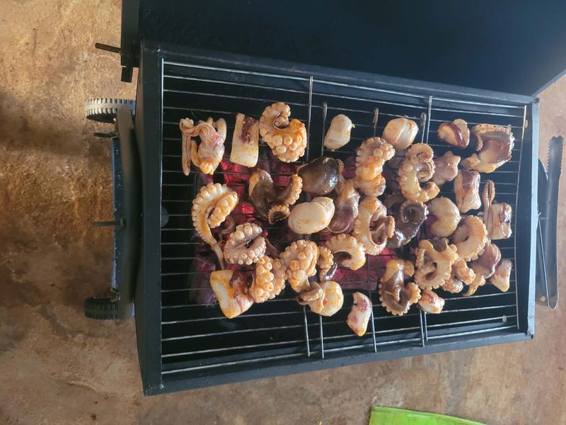 Seafood grilling over mangrove charcoal